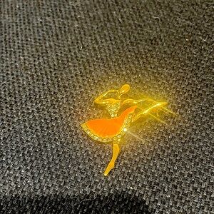 Elegant Gold and Orange Dancer Brooch